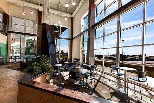 A bright lounge and cafe area at Choice Health & Fitness, where its on-site partner services are based
